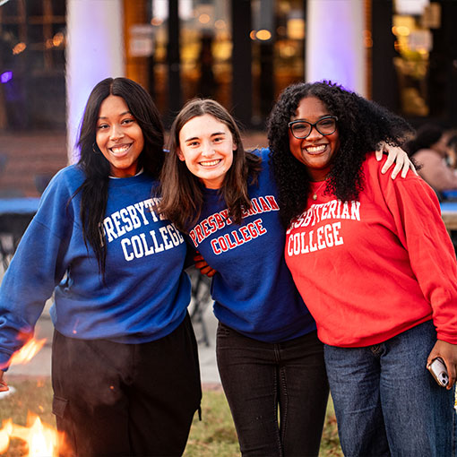 Three students smiling. Links to What to Give gifts_what_to_give.jpg