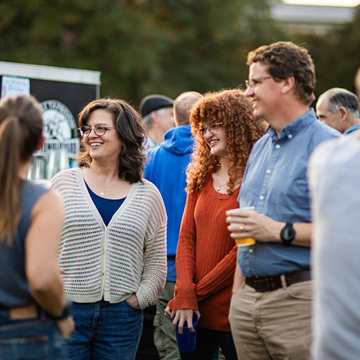 People smiling and talking to each other. Links to Closely Held Business Stock People smiling and talking to each other. Links to Closely Held Business Stock